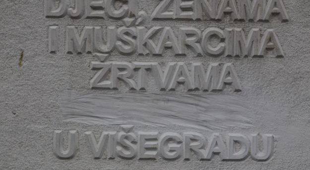 Memorial tombstone at Straziste cemetery after the word; genocide (Genocid) had been removed 